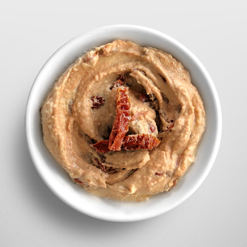 Small dip bowl of Hummus & Paprika Sauce